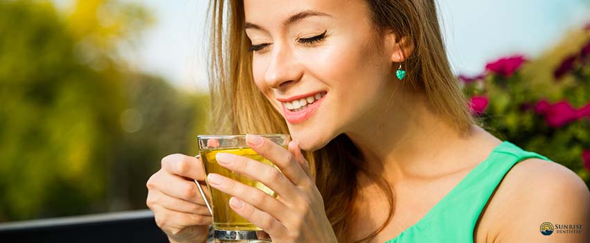SD-Happy Woman Drinking Green Tea Outdoors