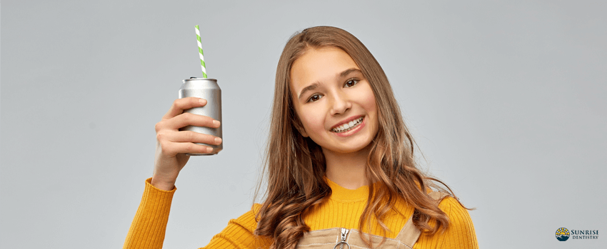 SD-Happy teenage girl drinking soda from can