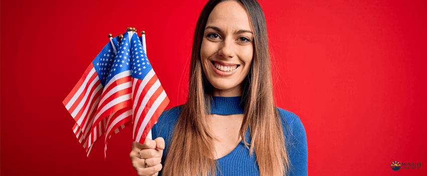 SD-Young blonde patriotic woman holding usa flag