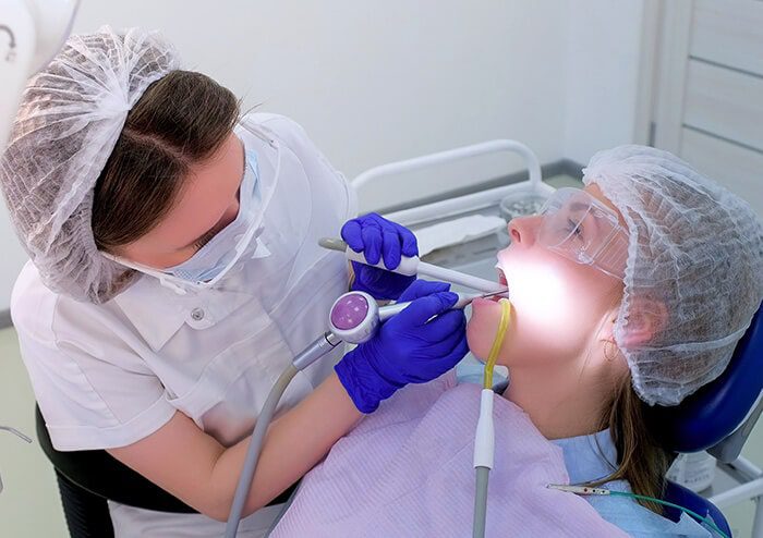 SD Dentist checking Patient's Teeth